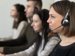 call center team wearing headsets at computers