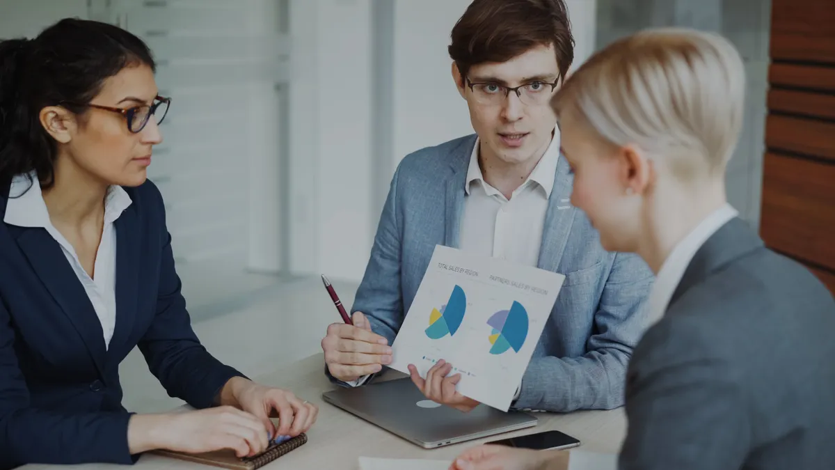 Best SaaS tools for sales teams Best SaaS tools for sales teams — Business Meeting Team Discussing Sales Strategy