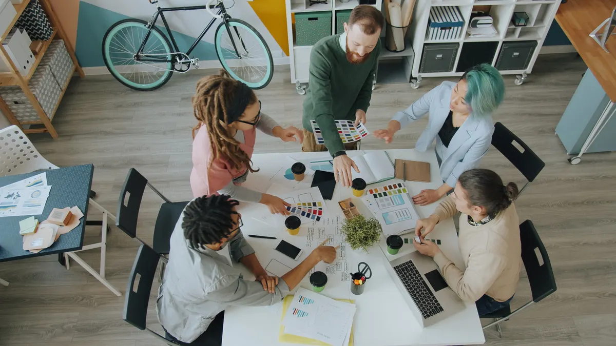 How to choose between freemium and paid SaaS tools How to choose between freemium and paid SaaS tools — Creative Team Collaborating in Modern Office Space