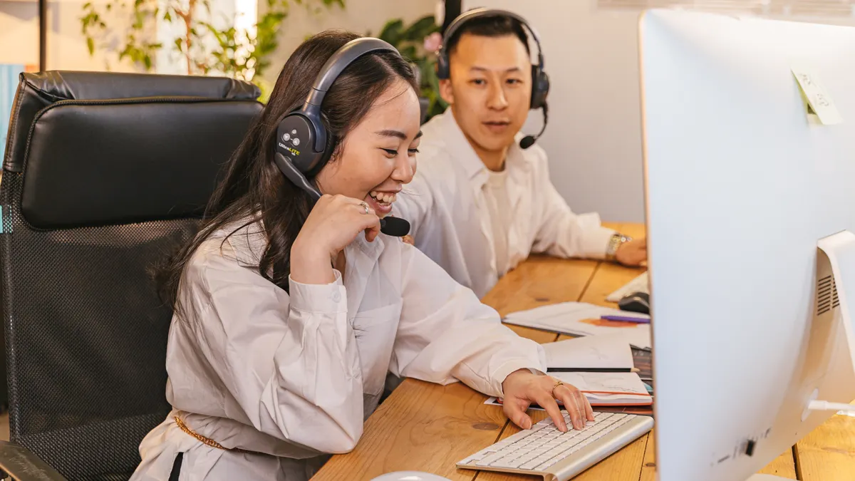 How to evaluate SaaS support quality before purchase two customer support agents in headsets at a computer