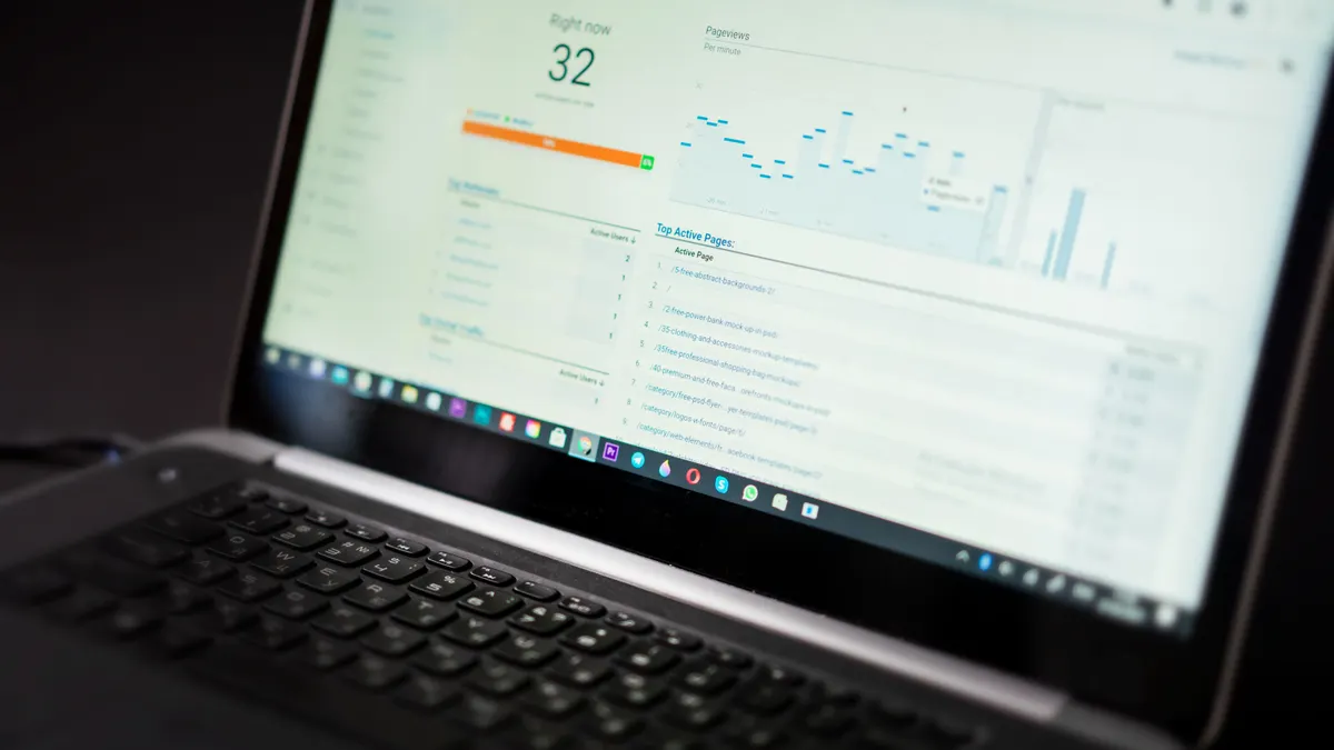 How to track SaaS usage before renewal decisions Laptop with business analytics dashboard and metrics