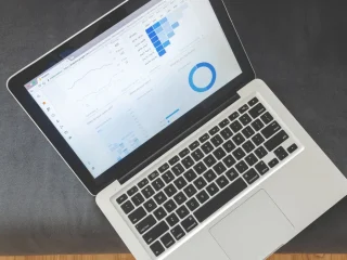 Laptop showing analytics dashboard with charts
