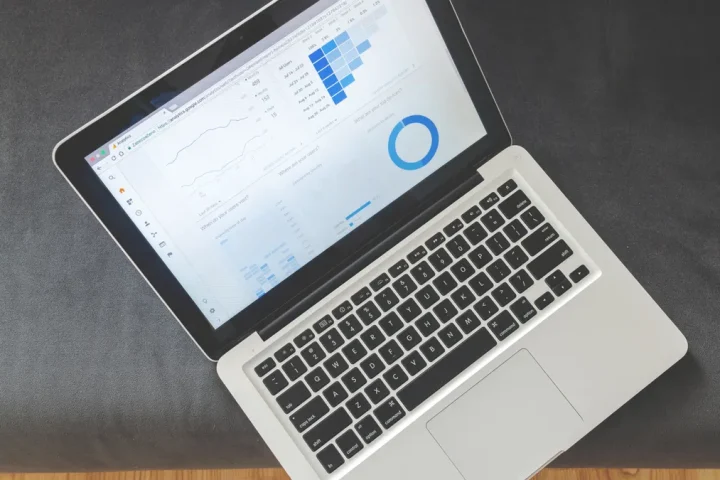 Laptop showing analytics dashboard with charts