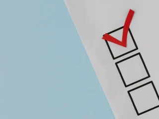 paper checklist with one red checkmark