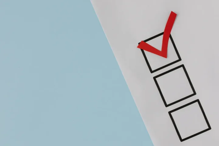 paper checklist with one red checkmark